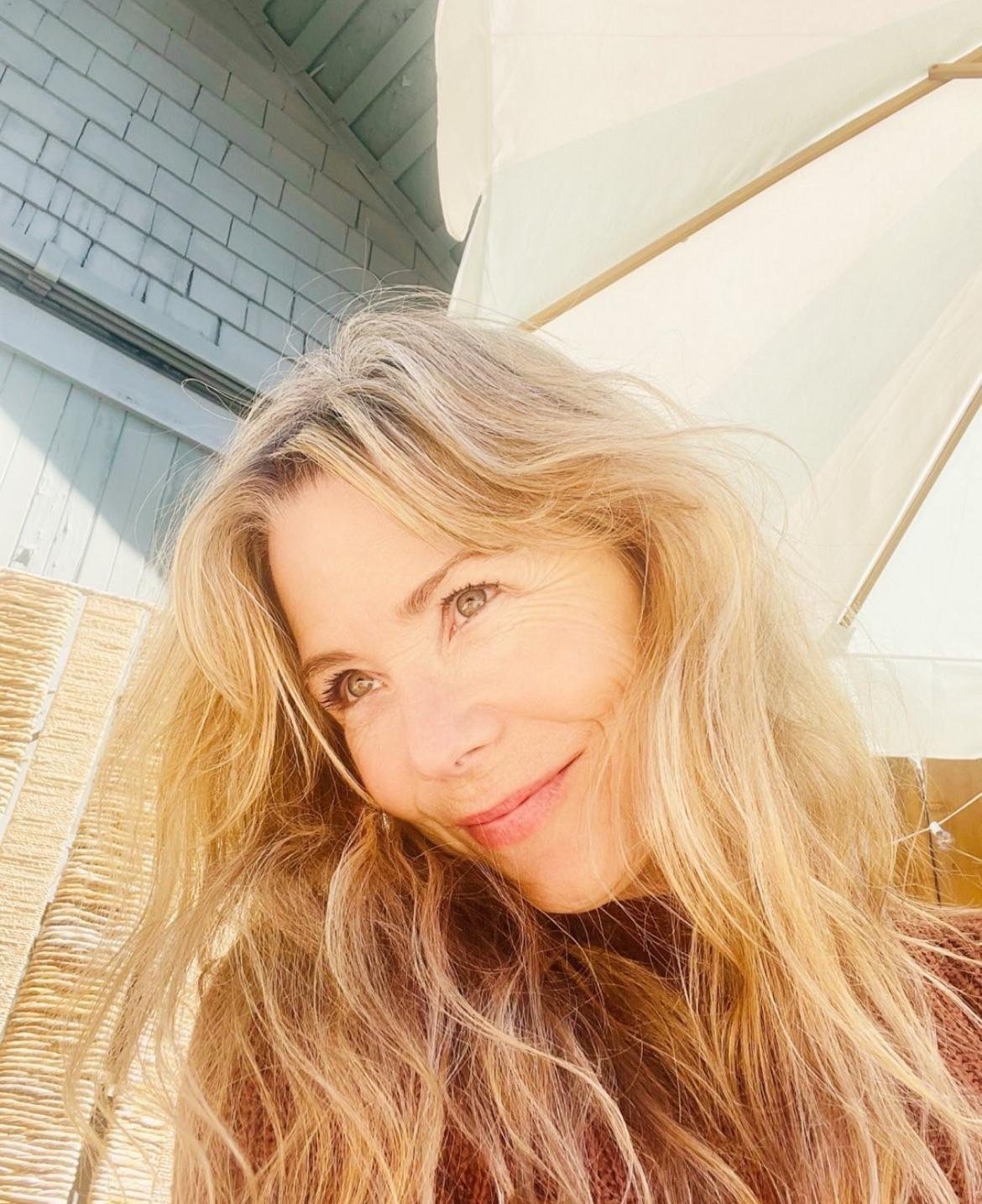 Christine smiling in golden light